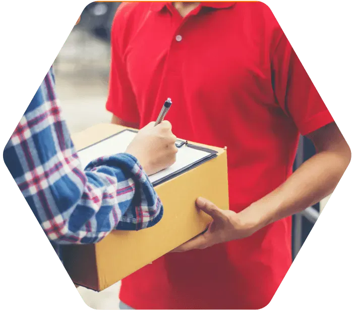 Customer signing a delivery receipt on a courier's clipboard